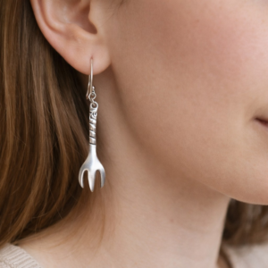 woman wearing sugar tong earrings