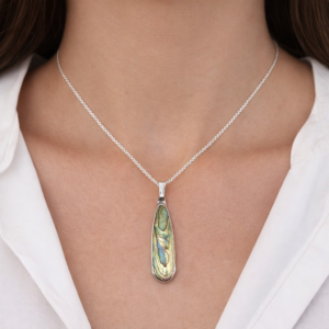 Woman wearing paua shell necklace