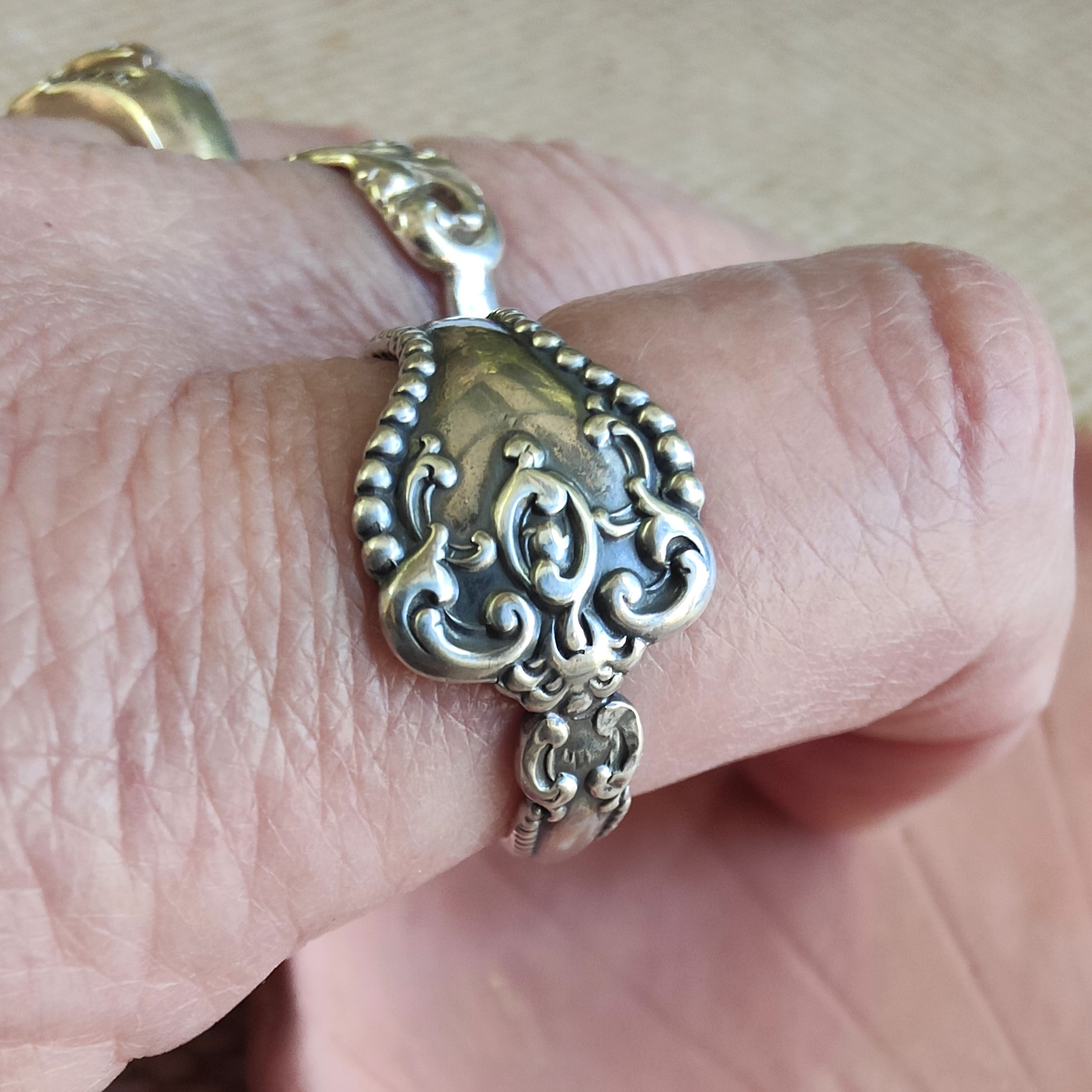 Vintage sterling silver Alvin Raleigh spoon ring handcrafted from a circa 1990 teaspoon, size V